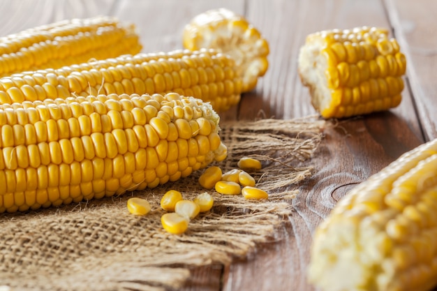 Fresh corn on wooden table