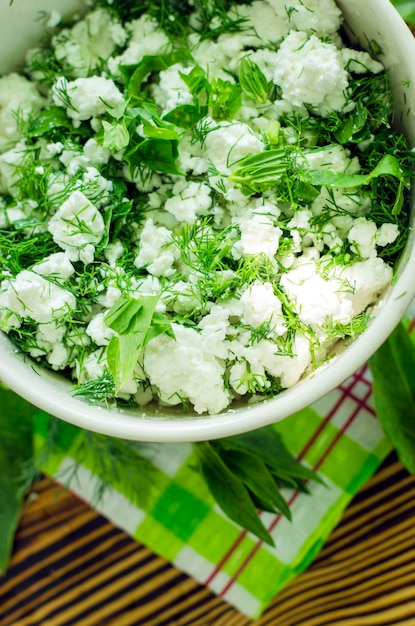 Fresh cottage cheese with spinach and herbs