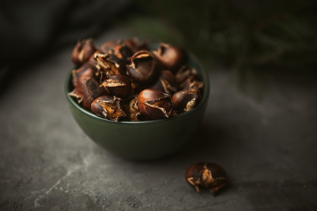 Fresh cracked roasted chestnuts in the bowl