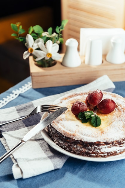 Fresh Creamy traditional cheesecake with grapes and sprinkled wi