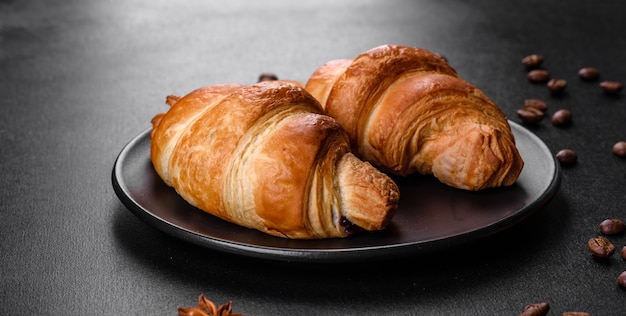 Fresh crisp delicious French croissant with a cup of fragrant coffee. Invigorating breakfast