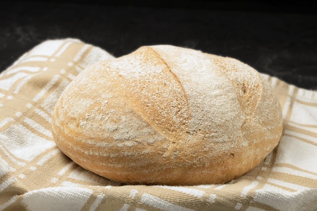 Fresh and crispy bread dissolves on the towel