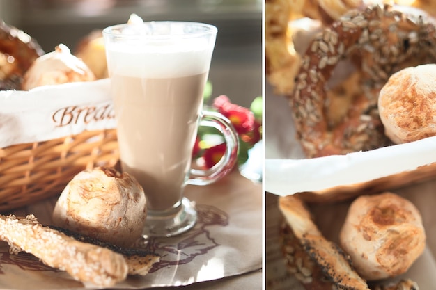 Fresh crispy buns and croissants in a wicker basket and frothy cappuccino