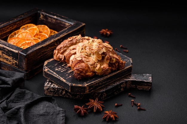 Fresh crispy croissant with almond chips and chocolate filling