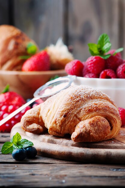 Fresh croissant with mix of berries