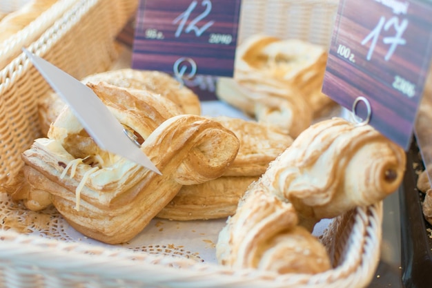 Fresh croissants in a basket on the shop counter