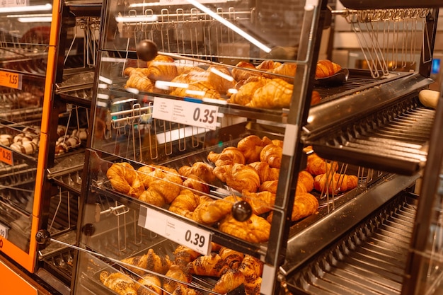 Fresh croissants on the dessert counter in a European patisserie Barcelona Spain