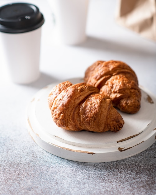 Fresh croissants on a light background