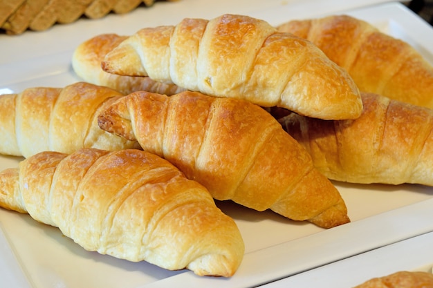 fresh croissants on a plate in breakfast