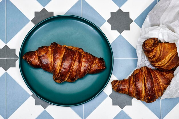 Fresh croissants on tiles floors