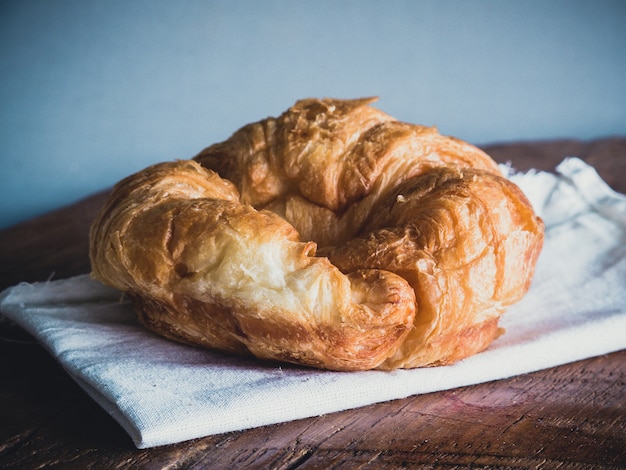 Fresh croissants on wood gray background