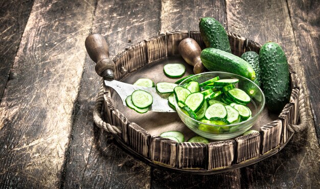 Fresh cucumber on an old tray