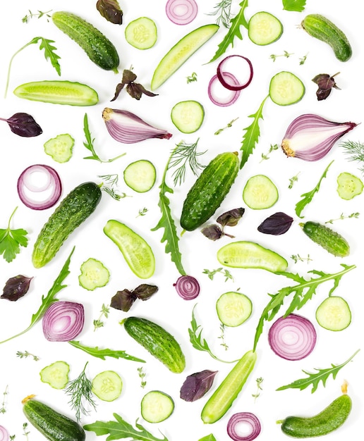 Fresh cucumber onion parsley dill basil and arugula on white background Flat lay composition Top view