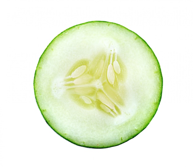 Photo fresh cucumber slice on white wall.