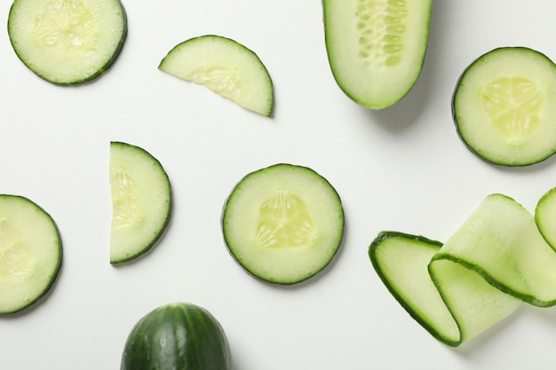 Fresh cucumber slices on white background, top view