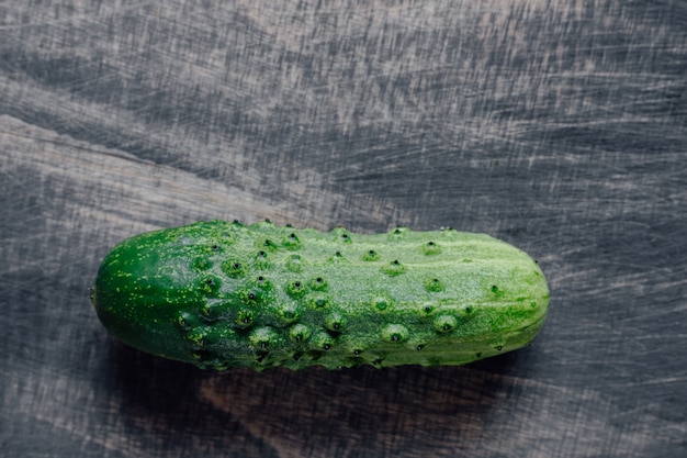 Fresh cucumber, with black wood space