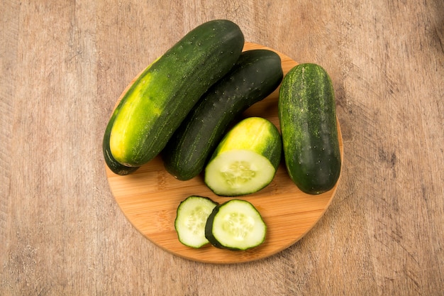 Fresh cucumber on the wooden table. Fresh vegetable.