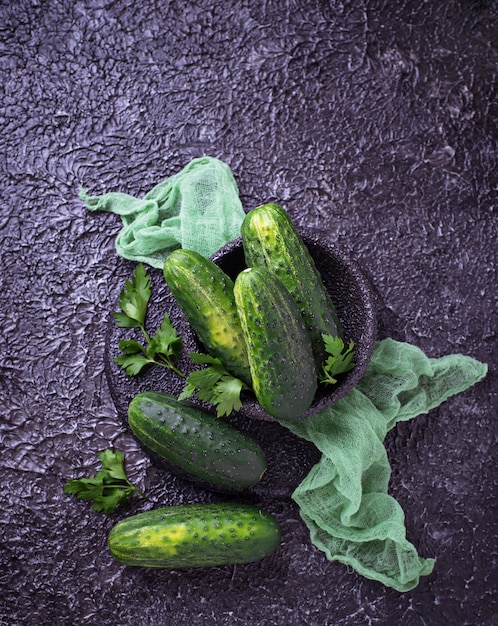 Fresh cucumbers on concrete background. Top view