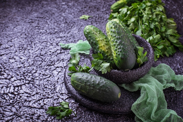 Fresh cucumbers on concrete background. Top view