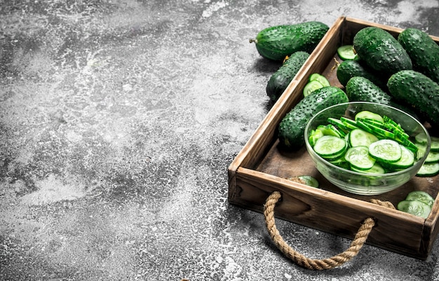 Fresh cucumbers in an old tray.