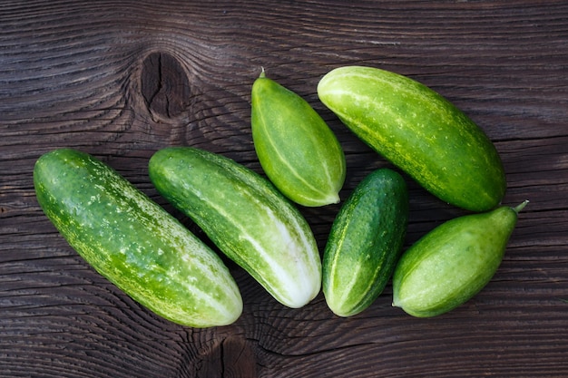 Fresh cucumbers on the wooden table Cucumbers on a wooden background