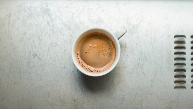 a fresh cup of coffee on table