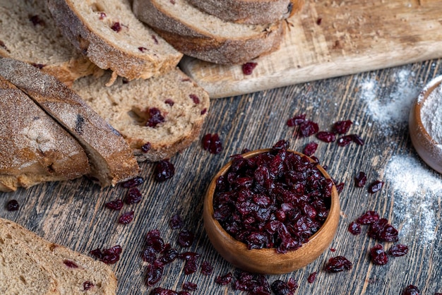 Fresh cut bread made of flour and dried cranberries