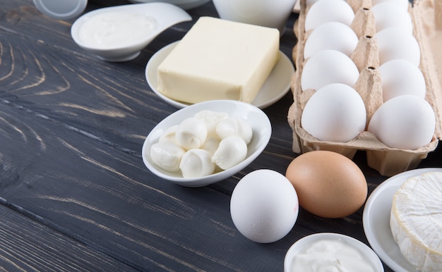 Fresh dairy products on blue wooden background