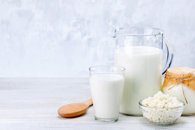 Fresh dairy products on white wooden table. Copy space.