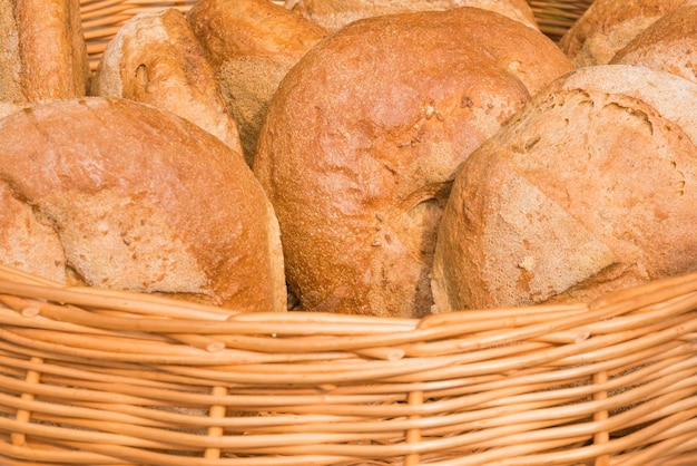 Fresh delicious bread in a wicker basket background