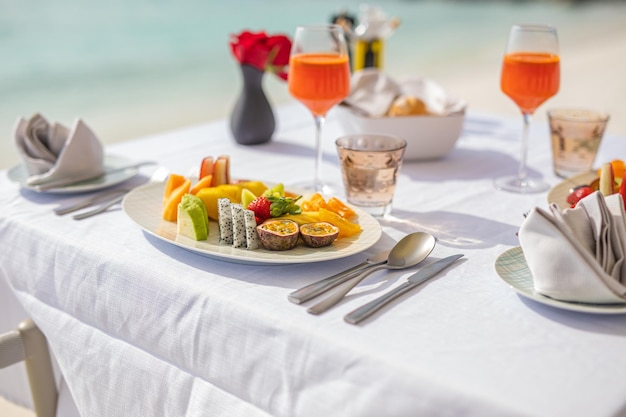 Fresh and delicious breakfast in outdoor hotel resort cafe. Carefree breakfast concept, summer