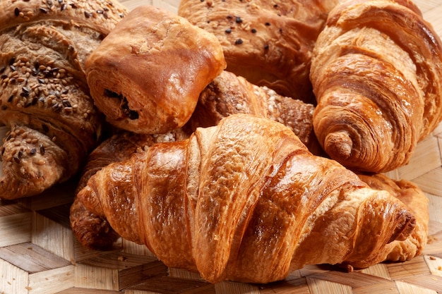 Fresh delicious croissants in bakery