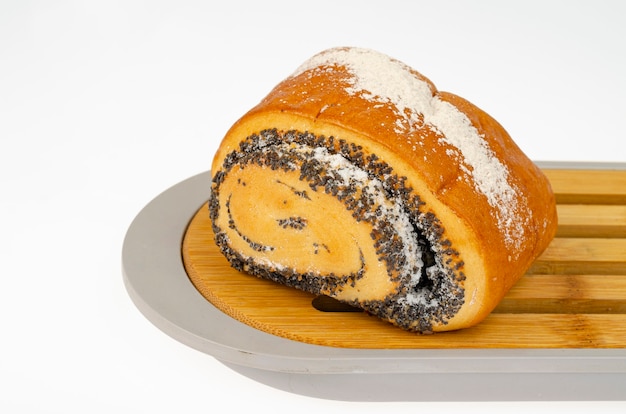 Fresh delicious homemade pastries, poppy seed bun. Studio Photo.