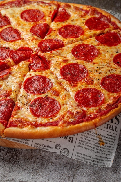 Fresh delicious Italian pizza on a gray stone table background