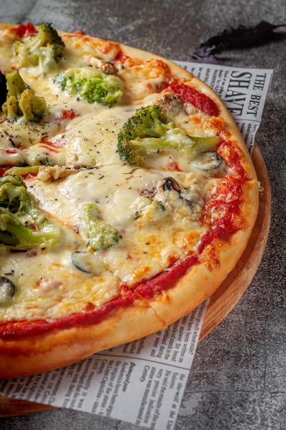 Fresh delicious Italian pizza on a gray stone table background