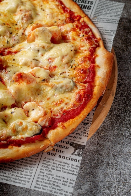 Fresh delicious Italian pizza on a gray stone table background