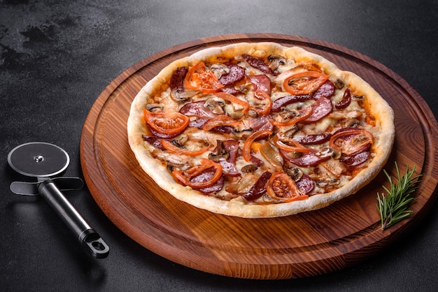 Fresh delicious pizza made in a hearth oven with sausage, pepper and tomatoes. Mediterranean cuisine