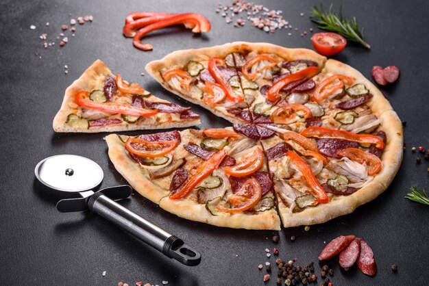 Fresh delicious pizza made in a hearth oven with sausage, pepper and tomatoes. Mediterranean cuisine