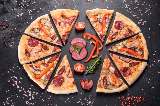 Fresh delicious pizza made in a hearth oven with sausage, pepper and tomatoes. Mediterranean cuisine