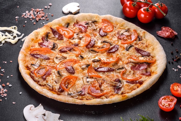 Fresh delicious pizza made in a hearth oven with tomatoes, sausage and mushrooms. Mediterranean cuisine