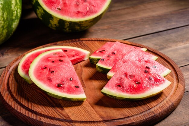 Fresh delicious watermelon slices on the wooden board