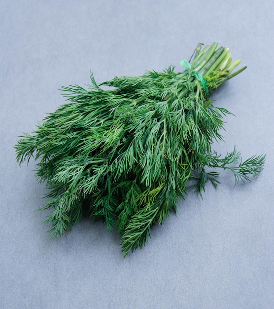 Fresh dill on dark stone background Top view