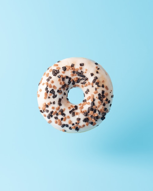 Fresh donut on blue background