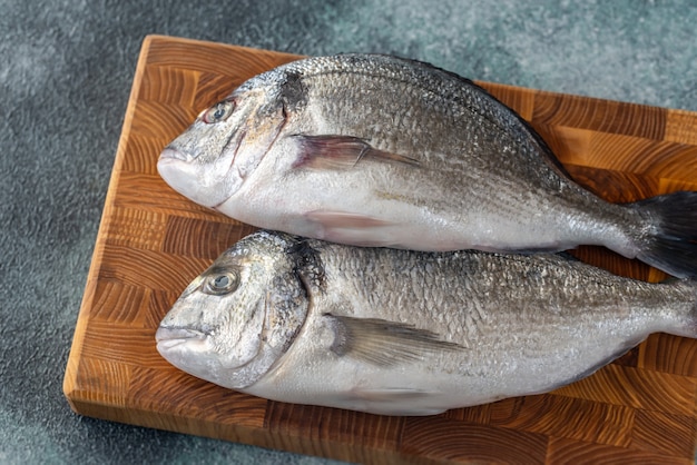 Fresh dorada on the wooden board