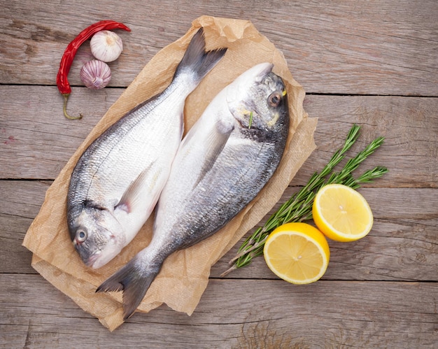 Fresh dorado fish cooking with spices and condiments