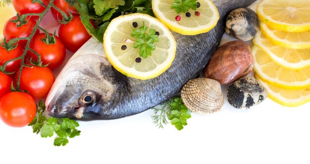 Fresh dorado fish, seafood, tomatoes, lemon and herbs