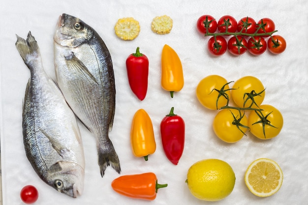 Fresh dorado fish with vegetables.