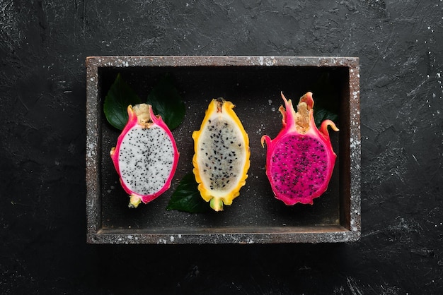 Fresh Dragon Fruit on a Black Background Tropical Fruits Top view Free space for text
