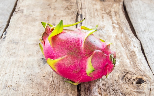 Fresh dragon fruit on wooden background