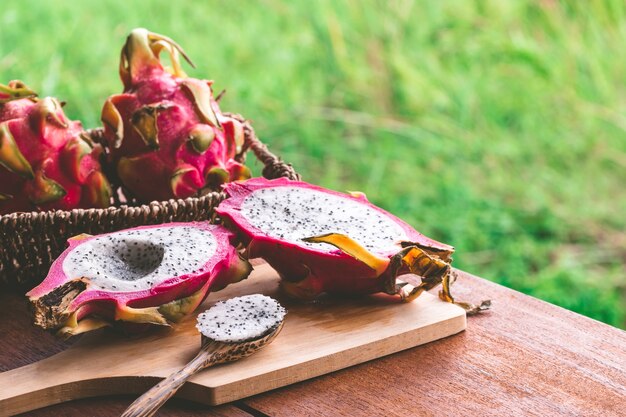 Fresh dragon fruit on wooden table